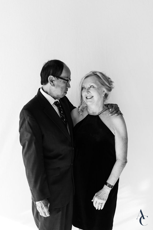 Couple posing arm in arm at the portrait station